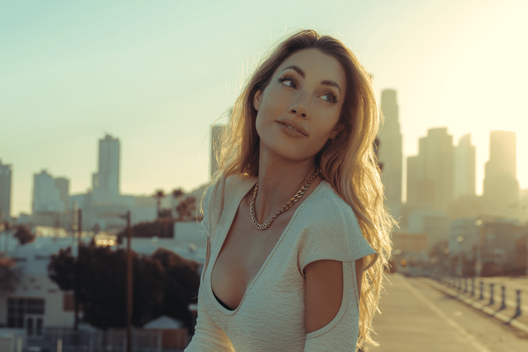 Blonde woman standing on a sidewalk in LA